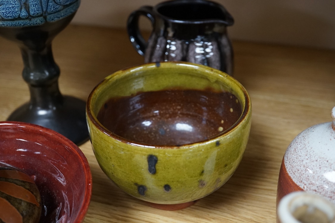 A collection of studio pottery to include a Celtic pottery Newlyn goblet, various jugs and bowls, largest 19cm high